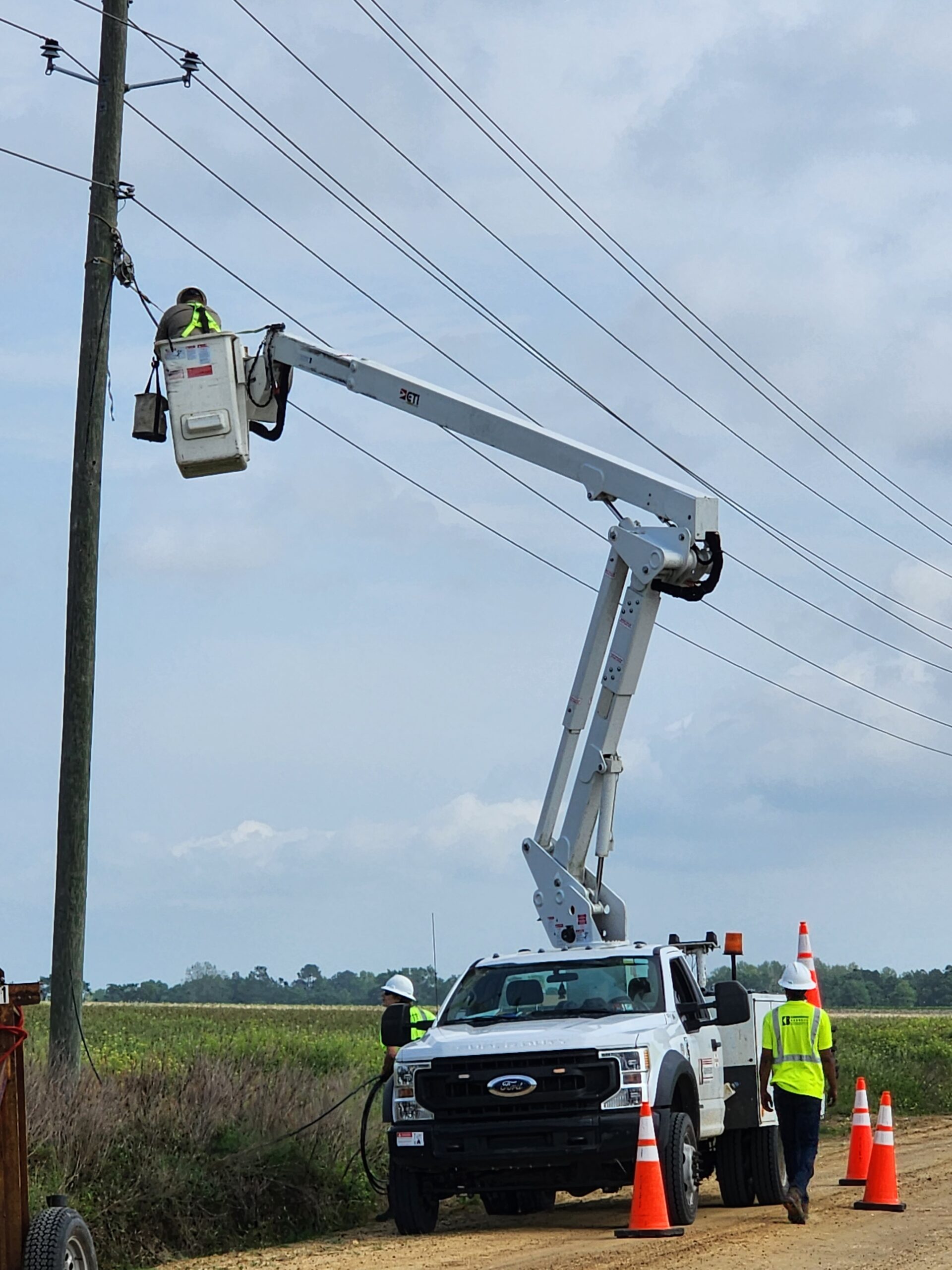 Aerila lineman working in bucket truck
